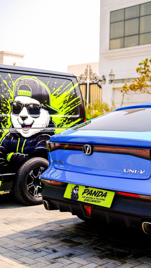 Blue Changan UNI-V with a Panda plate beside the Panda van
