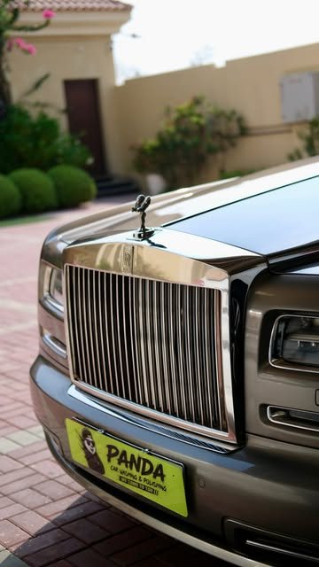Rolls-Royce with a Panda Car Wash plate after cleaning