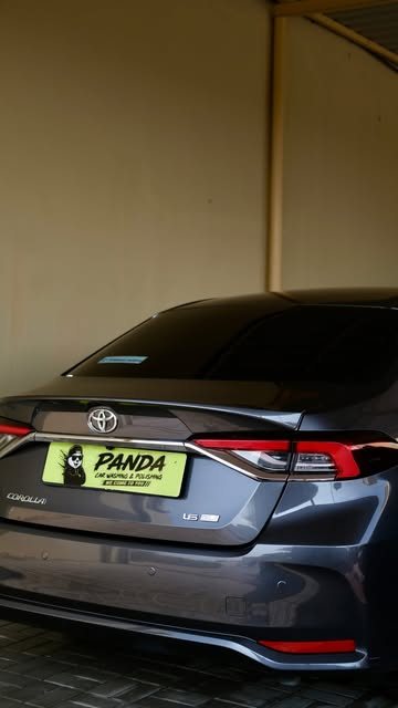 Grey Toyota sedan with a Panda Car Wash plate